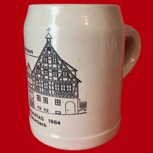 GERMANY SPORTS STONEWARE MUG. 5 INCHES TALL 6 INCHES WIDE.